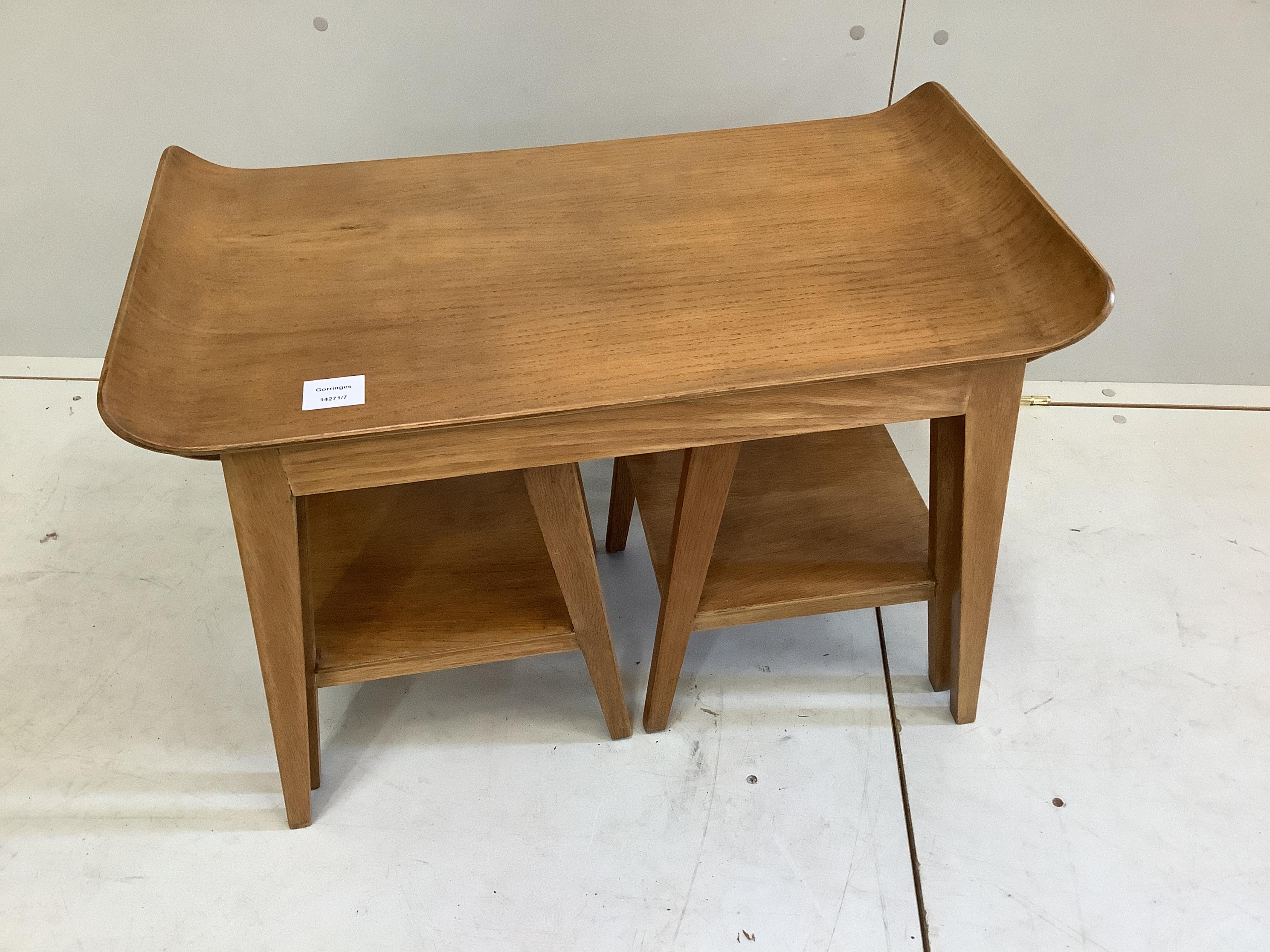 An oak nest of three mid century oak tea tables, width 67cm, depth 38cm, height 49cm